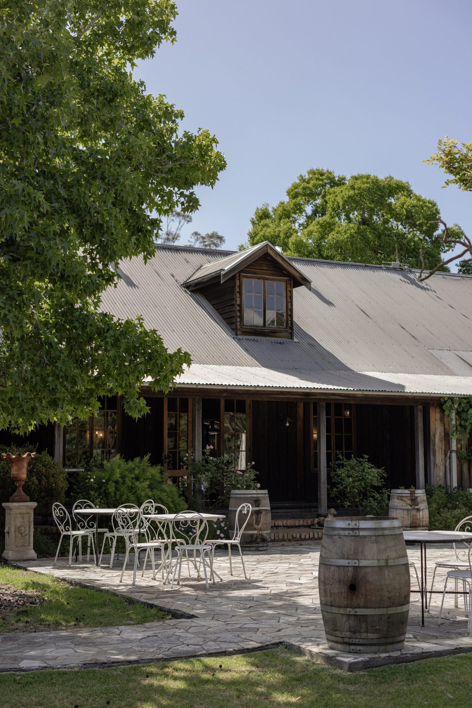 The Circa 1876 cottage with a table set under the tree