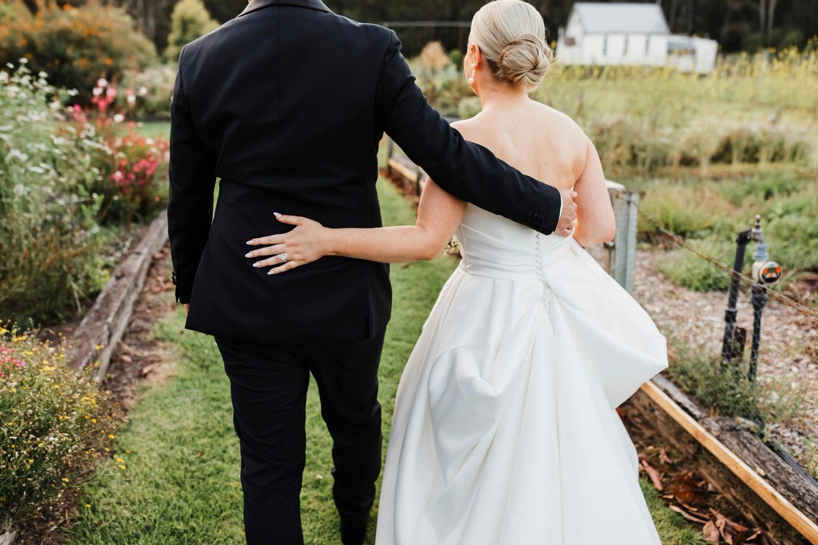 A couple from behind on the lawn